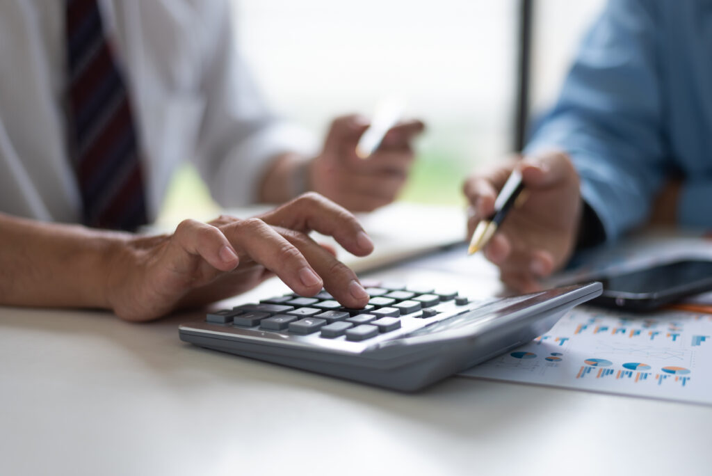 Business Asian middle age people using calculator to calculating finance bills.